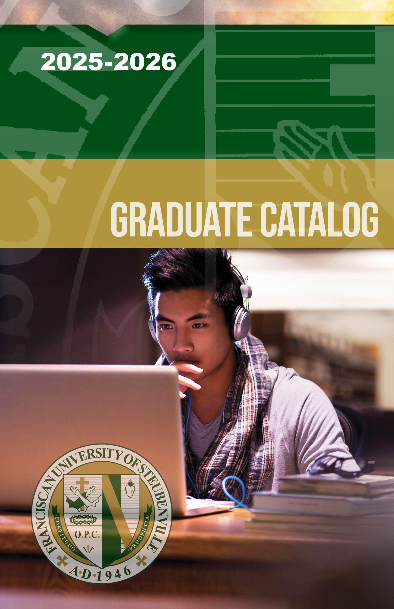 Male student working on laptop in library