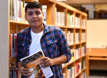 KCC student with business book